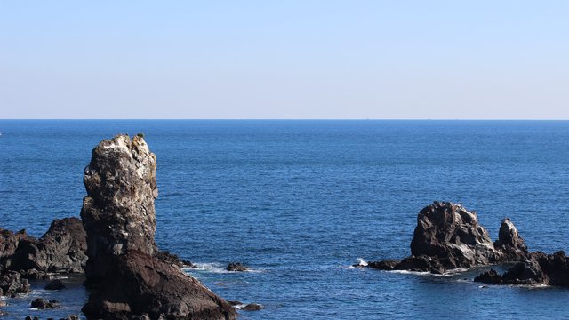 Jeju Island Coastal Rocks and Deep Blue Sea