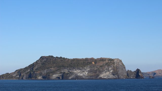 Coastal Island Seascape with Blue Sky and Ocean
