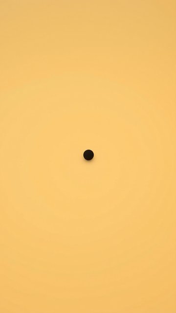 Minimalist Black Dot on Pale Peach Background