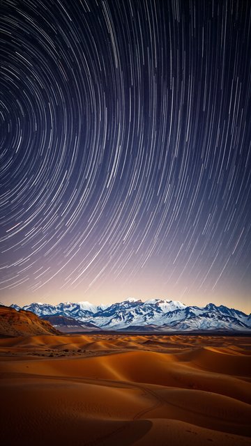 Star Trails Over Desert Dunes & Snowy Mountains