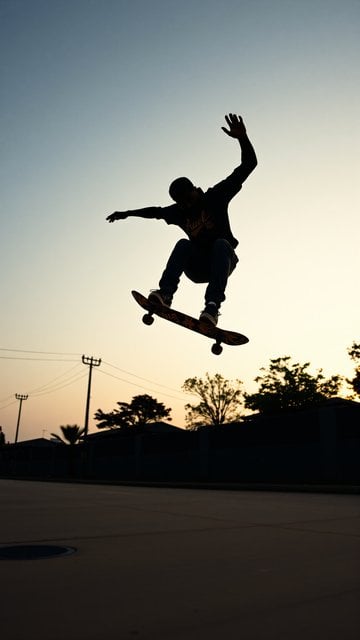 Skateboarder Sunset Jump Silhouette Wallpaper